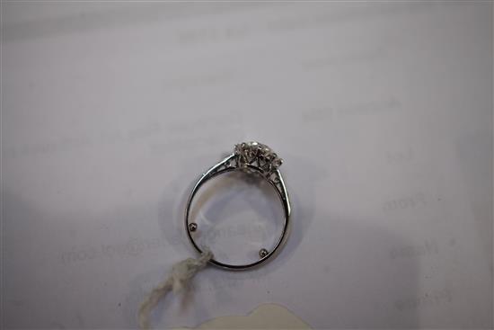 A 1940s/1950s platinum and single stone diamond ring with diamond set shoulders, size L.